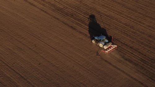 Blue Tractor at Work in Field
