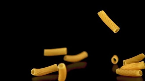 Rigatoni Pasta Falling in Slow Motion on Black