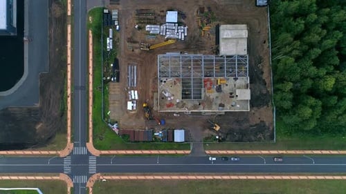 Aerial View of Construction Site Near Green Space