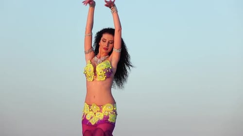 Beautiful Woman Performs Belly Dance in Desert