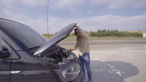 The man whose car broke down is helpless.