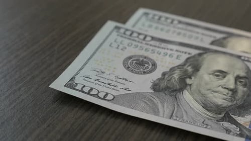 Slow motion American dollar banknotes fall on table close-up 1080p FullHD footage - Counting USD cur
