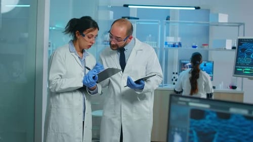 Scientists Collaborate on Research in Modern Lab