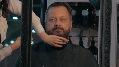 Man Getting Beard Styled in Barbershop