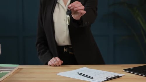 Businesswoman Holding Keys in Office