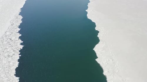 Slow Flight of a Drone Over Floating Ice in a Strait Among Solid Ice