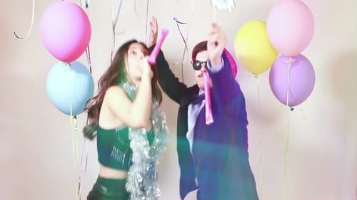Slow motion of funny crazy couple having awesome time dancing