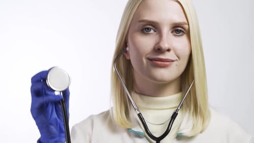 Medical Professional Holds Stethoscope for Patient Examination