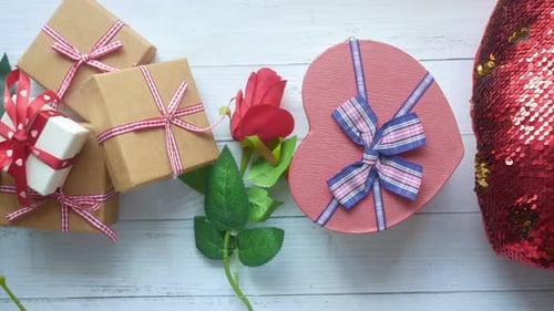 Top View of Gift Box and Rose Flower on Color Background
