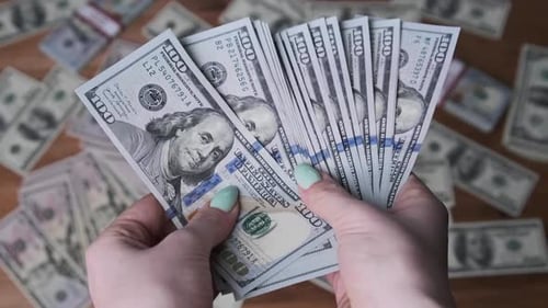 Woman Hands Count Large Fan of $100 Bills