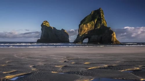 Archway on empty beach