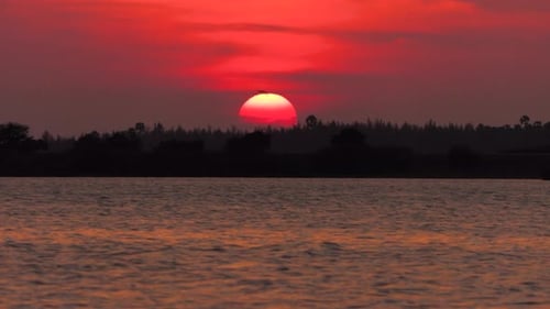 Timelapse of beautiful Sunset over water