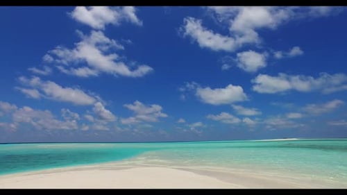Aerial drone panorama of tropical coastline beach break by blue green sea with white sandy backgroun