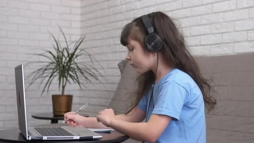 Girl Studying Online With Laptop and Headphones