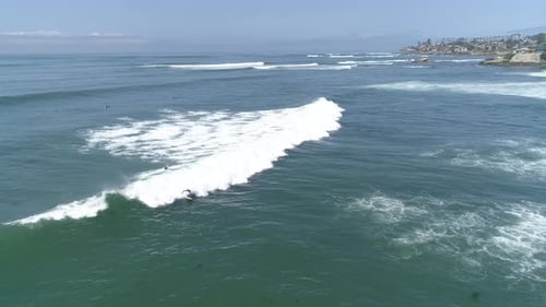 Aerial view of ocean surfing