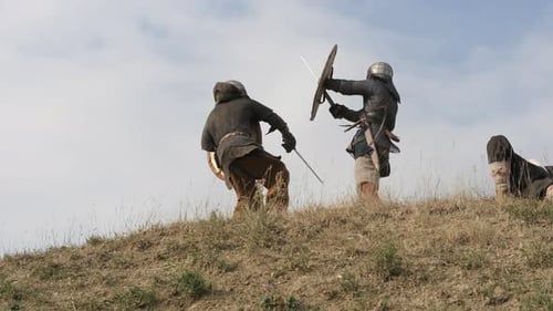 Medieval Warriors Engage in Fierce Combat on Hillside