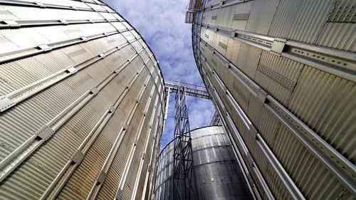 Grain Silos and Farm Storage on Sunny Day