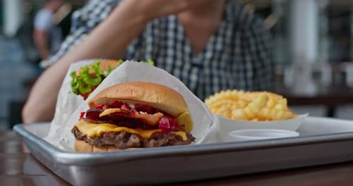 Close Up of Cheeseburger and Fries on Tray
