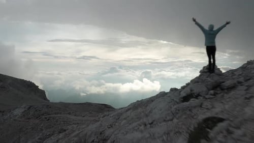 Drone Flight Over Mountain Landscape With Hiker In Awe
