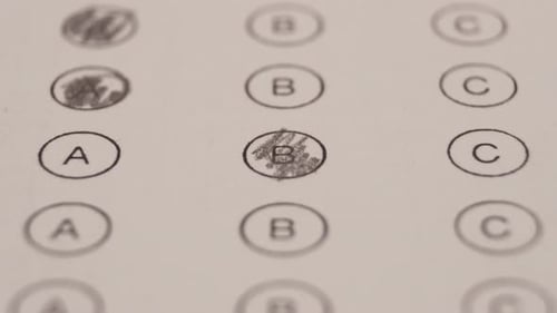 Filling Bubble Test With A Pencil. Education And Exams Concept. Close Up