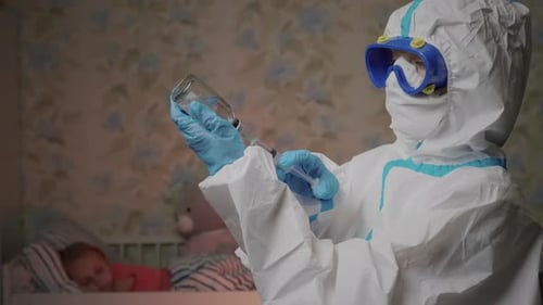 Medical Worker Preparing Vaccine for Baby