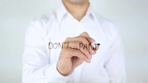 Man Writes 'Don't Panic' on Clear Surface
