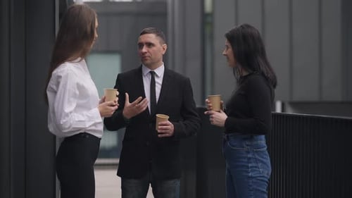 Business People Talking Outside Office Building
