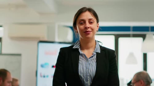 Confident Businesswoman Smiling in Bright Office Environment