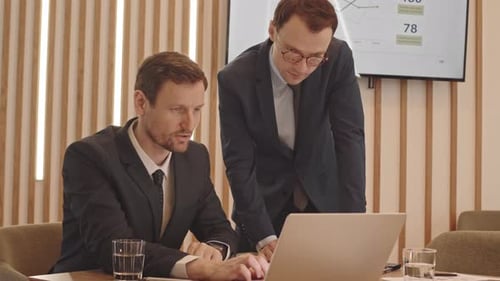 Businessmen Working on Corporate Project in Office