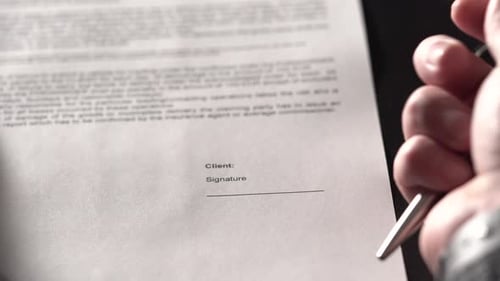 Close Up Shot of the Office Worker Hands, Who Signed an Agreement.