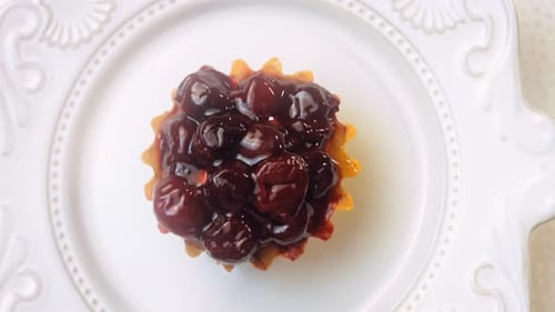 Delicious Cherry Tart on White Plate Close Up