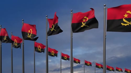Las banderas de Angola ondeando en el viento - 2K
