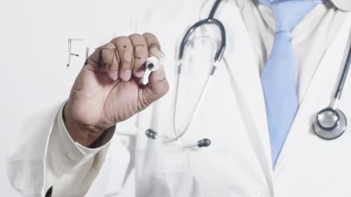 Doctor Writing Fitness on Clear Surface