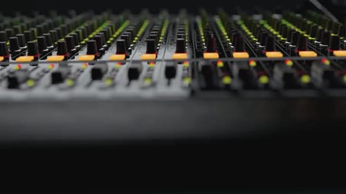 Close Camera Move To Right on Dj Mixer with Moving Sliders and Lighting Buttons