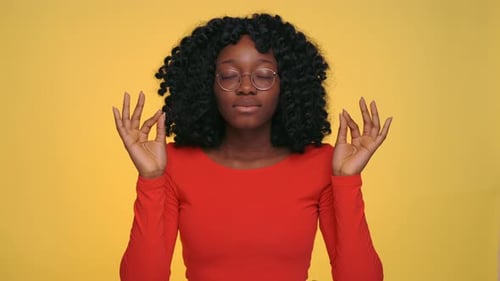 Portrait of Calm African Woman Meditating at Studio