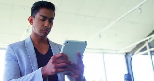 Executive using digital tablet in office 4k