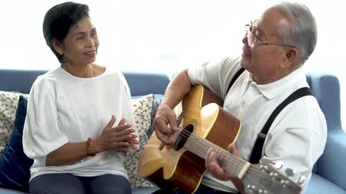Senior Couple Enjoying Music at Home