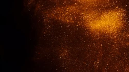 Golden Sand or Dust Creating Abstract Formations In the Form of the Sun on Black Background