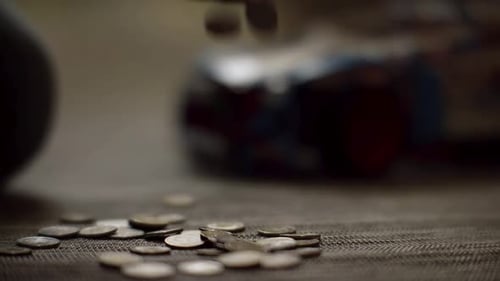 Loose Change Deposited on Table