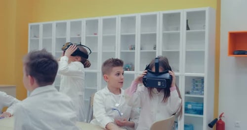 Children Using VR Headsets in Classroom Setting