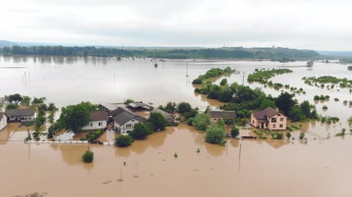Aerial View Floods and Flooded Houses. Mass Natural Disasters and Destruction. A Big City Is Flooded