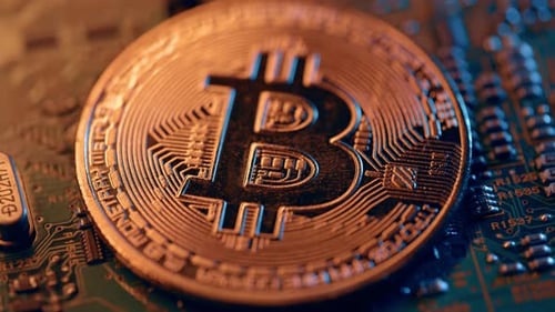 Golden Bitcoin Coin on Green Circuit Background