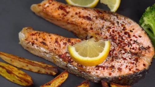 Salmon Steak with Lemon and Potato Wedges
