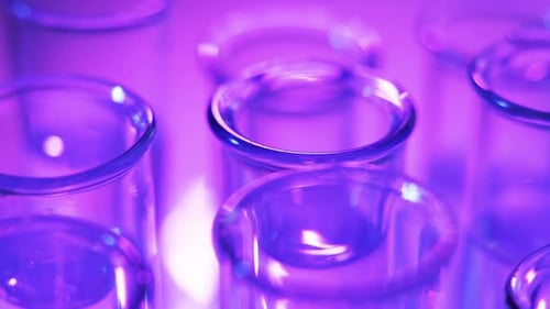 In the Laboratory, the Scientist Analyzes the Colored Fluid in the Test Tube.