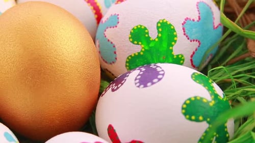 Colorful Painted Easter Eggs in Green Grass Close Up