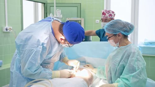 Surgeons Perform Operation in Brightly Lit Operating Room