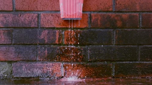 Rain Water Flows From the Gutter Slowmotion
