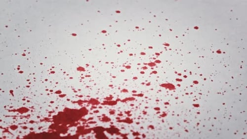 Red Liquid Splattering on White Surface
