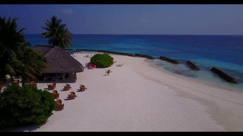 Aerial drone shot sky of exotic lagoon beach holiday by blue water and white sandy background of a d