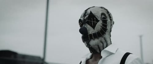 Masked Person in Sack with Blue Nose